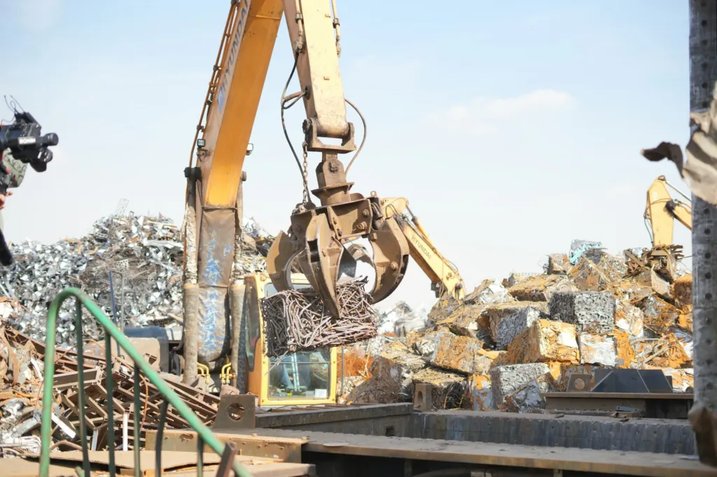 Excavator sorting scrap metal